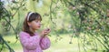 Little girl under blooming apple tree Royalty Free Stock Photo