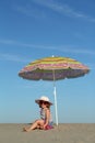 Little girl under sunshade