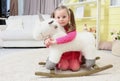 Little girl with a unicorn in the children& x27;s room. Child 4-5 years old in a children& x27;s room with toys. A baby in