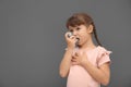 Little girl using asthma inhaler Royalty Free Stock Photo