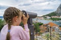 Little girl using telescope. Royalty Free Stock Photo