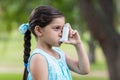 Little girl using his inhaler Royalty Free Stock Photo