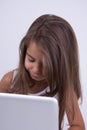 Little Girl using laptop with facial expression Royalty Free Stock Photo