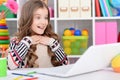 Portrait of little girl using modern laptop Royalty Free Stock Photo