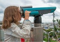Little girl using telescope. Royalty Free Stock Photo