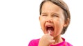 Little girl using toothpick to clean his teeth on Royalty Free Stock Photo