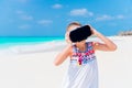 Little girl using VR virtual reality goggles. Adorable kid look into the virtual glasses on white beach Royalty Free Stock Photo