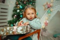 Little girl are very surprised to open christmas present Royalty Free Stock Photo