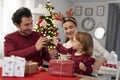 Girl waiting for opening Christmas presents Royalty Free Stock Photo