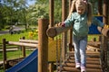 Little girl walk on outdoor slide