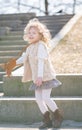 Little girl walking alone in the city park and enjoy. Royalty Free Stock Photo