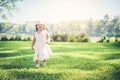 Little girl walking alone in a park Royalty Free Stock Photo