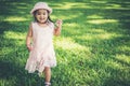 Little girl walking alone in a park Royalty Free Stock Photo