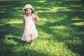 Little girl walking alone in a park Royalty Free Stock Photo