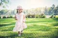 Little girl walking alone in a park Royalty Free Stock Photo