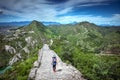 A little girl walking along the Great Wall of China