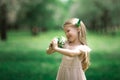 Little girl is walking in an apple garden Royalty Free Stock Photo