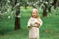 Little girl is walking in an apple garden Royalty Free Stock Photo