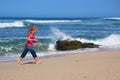 Little girl walking on beach Royalty Free Stock Photo