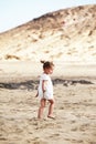 Little girl walking on beach Royalty Free Stock Photo