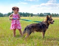 Little girl walking with dog Royalty Free Stock Photo