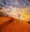 Little girl walking down the sand dune Royalty Free Stock Photo