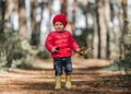 Little girl walking in the forest