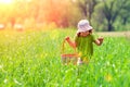 Little girl walking on the green field Royalty Free Stock Photo