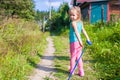 Little girl walking with her ??dog on a leash Royalty Free Stock Photo