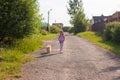 Little girl walking with her ??dog on a leash Royalty Free Stock Photo