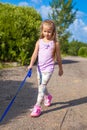 Little girl walking with her ??dog on a leash Royalty Free Stock Photo