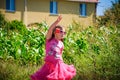 Little girl is walking on the road in the village Royalty Free Stock Photo