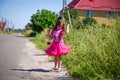 Little girl is walking on the road in the village Royalty Free Stock Photo