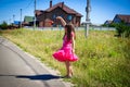 Little girl is walking on the road in the village Royalty Free Stock Photo