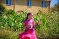 Little girl is walking on the road in the village Royalty Free Stock Photo