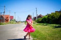 Little girl is walking on the road in the village Royalty Free Stock Photo