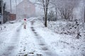 Little girl walking on snowy rural road Royalty Free Stock Photo