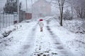 Little girl walking on snowy rural road Royalty Free Stock Photo