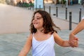 Little girl walking to the beach holding the hand of her mother. Royalty Free Stock Photo