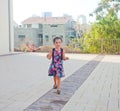 Little girl walking towards camera Royalty Free Stock Photo