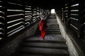 Little girl walks up the famous Covered Stairway Scara acoperita or The Scholars` Stairs, that lead up from the fortress and