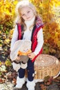 Little girl in warm clothes with toy rabbit Royalty Free Stock Photo