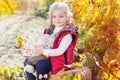 Little girl in warm clothes with toy rabbit Royalty Free Stock Photo