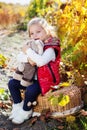 Little girl in warm clothes with toy rabbit Royalty Free Stock Photo