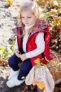 Little girl in warm clothes with toy rabbit Royalty Free Stock Photo