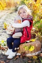 Little girl in warm clothes with toy rabbit Royalty Free Stock Photo