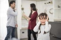 Little girl was crying because dad and mom quarrel, Sad and dramatic scene, Family issued, Children`s Rights abused in Early Royalty Free Stock Photo