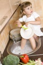 Little girl washing dishes Royalty Free Stock Photo