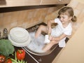 Little girl washing dishes Royalty Free Stock Photo