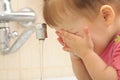 Little girl washing face Royalty Free Stock Photo